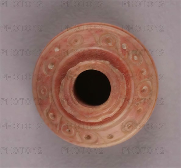 Spindle Whorl, Iran, 9th-10th century.  Excavated at Nishapur, providing evidence the city possessed a thriving textile industry.