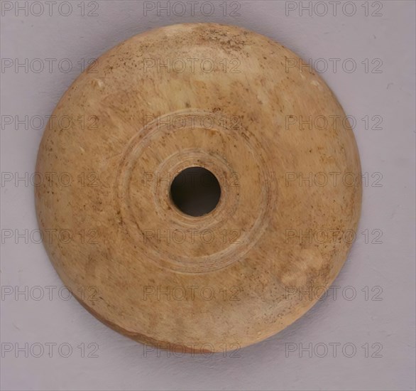 Spindle Whorl, Iran, 9th-10th century.  Excavated at Nishapur, providing evidence the city possessed a thriving textile industry.