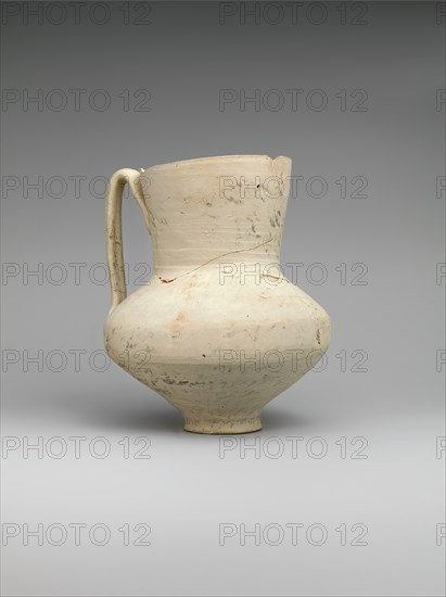 Unglazed Jug with Writing, Iran, 8th-9th century. Entire surface covered with writing, with faint image of a demon possibly an incantation vessel.