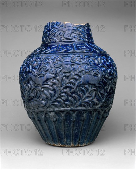 Large Jar, Iran, dated A.H. 681/A.D. 1282-83. Verses read: "Tumultuous air and boiling earth; Joyous is he whose heart is happy. Drink!"