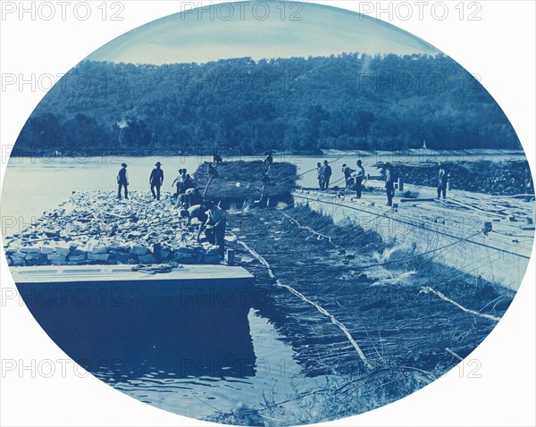 Construction of Rock and Brush Dam, Low. Water. 1891, 1891.