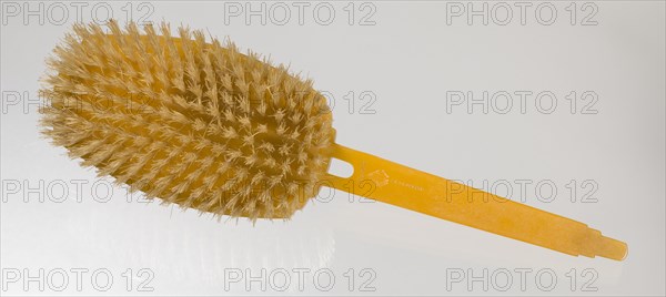 Bakelite hair brush from dresser set owned by Lena Horne, mid 20th Century. Creator: Agalin.