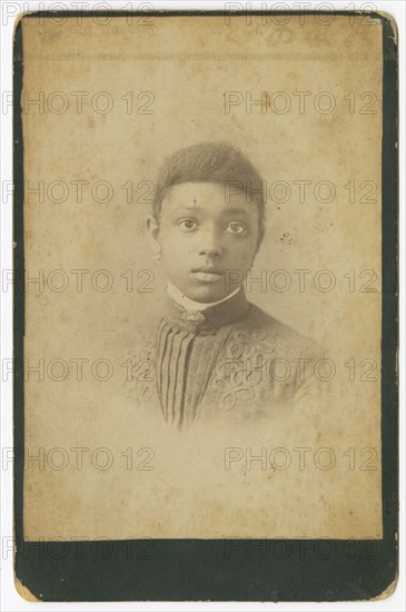 Photograph of a girl wearing a pleated dress, 1885-1900. Creator: Unknown.