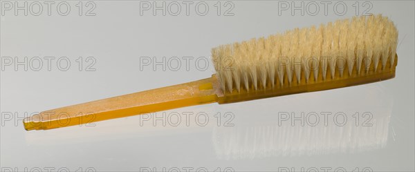 Bakelite clothes brush from dresser set owned by Lena Horne, mid 20th Century. Creator: Agalin.