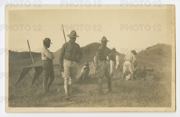 Photographic postcard of Charles Wilbur Rogan with his unit in the Philippines, 1910-1919. Creator: Unknown.