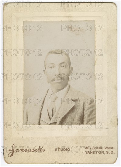 Photograph of a man wearing a light colored jacket, vest and necktie, late 19th century. Creator: Louis Janousek.