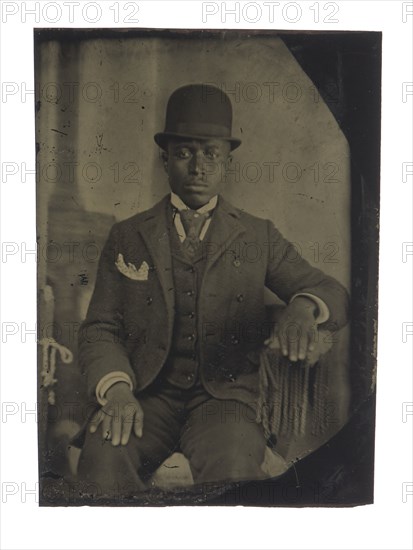 Tintype of man in suit, tie, and hat, after 1860s. Creator: Unknown.