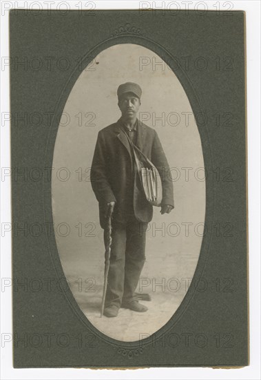 Cabinet card of a newspaper carrier, mid to late 19th century. Creator: Unknown.