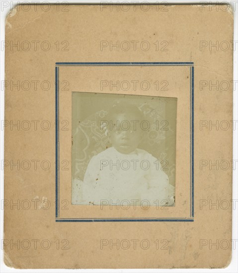 Photograph of a baby sitting in a chair, ca. 1870. Creator: Unknown.