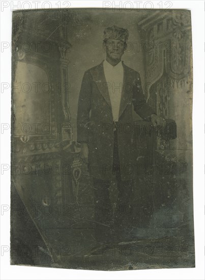 Tintype portrait of a man wearing a fur hat, late 19th century. Creator: Unknown.