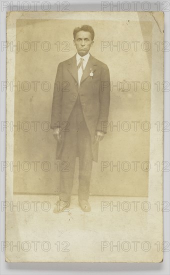 Photographic postcard of a man in a suit, 1904-1918. Creator: Unknown.