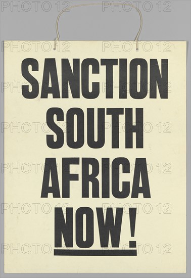Placard reading "Sanction South Africa Now!", late 20th century. Creator: Unknown.