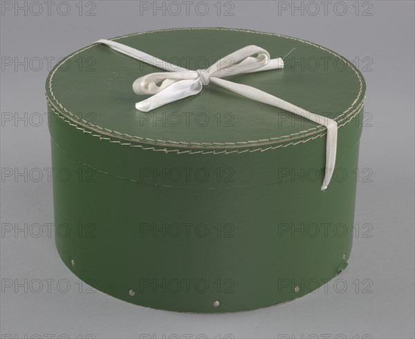 Green circular hatbox with lid from Mae's Millinery Shop, 1941-1994. Creator: Unknown.
