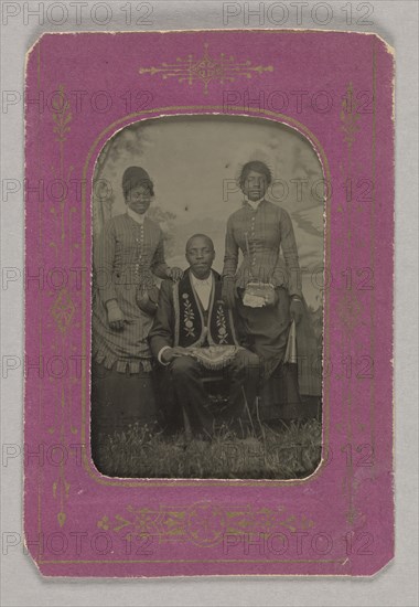 Tintype photograph of a man identified as James Turner, with two women, ca. 1873. Creator: H.G. Pearce.