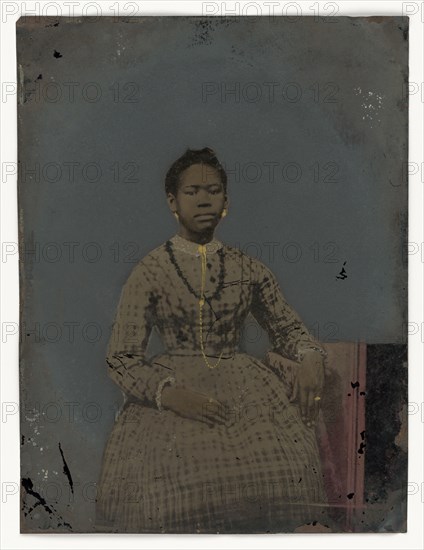 Tintype of a seated young woman, 1850-1875. Creator: Unknown.