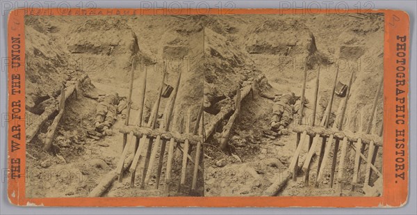 Stereograph of two deceased Confederate soldiers in a trench, 1865. Creator: Thomas C. Roche.