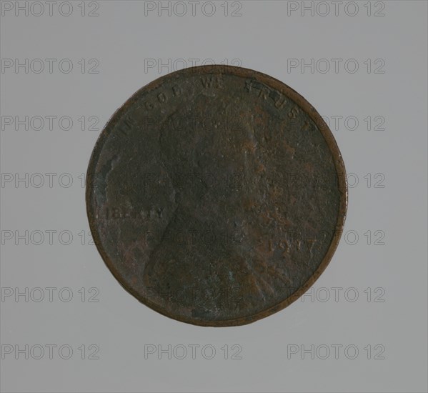 Riot penny charred during the 1921 Tulsa Race Massacre, 1917. Creator: United States Mint.