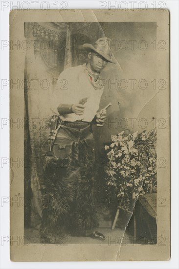 Photograph portrait of a man dressed as a cowboy, early 20th century. Creator: Unknown.