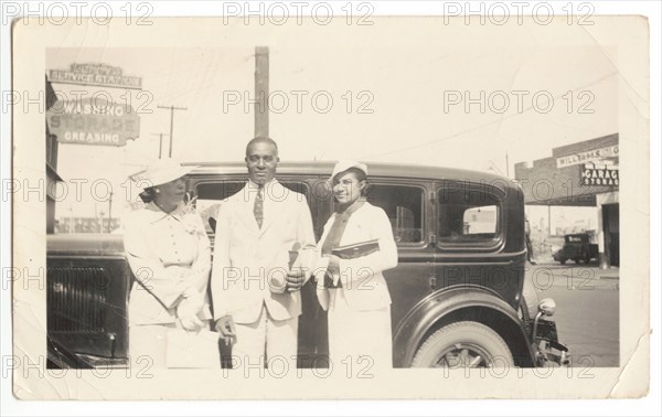 Photographic print of Mr. and Mrs. Jackson and another woman in front of car, 1926. Creator: Unknown.