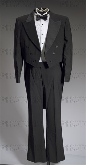 Black tail coat with white pocket handkerchief worn by Cab Calloway, 1976-1995. Creator: After Six.