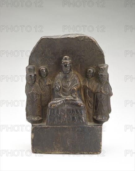 Seated Buddha (Shakyamuni) with standing monks and bodhisattvas..., Period of Division, 535. Creator: Unknown.