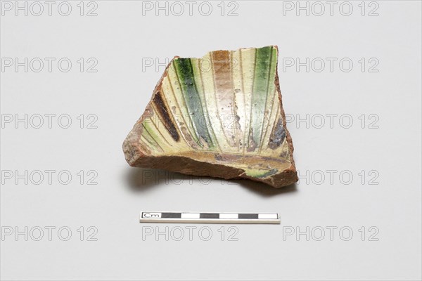 sherd, red body, white slip; green, brown, yellow striped glaze, Mamluk period, 1250-1516. Creator: Unknown.