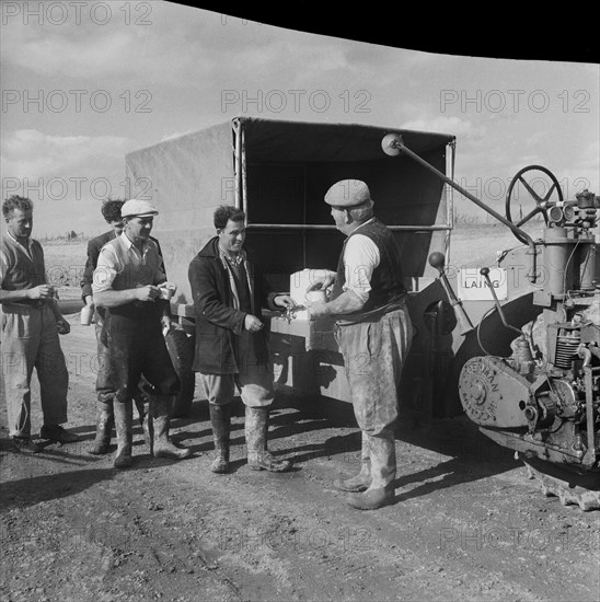 Construction of the M1, the London to Yorkshire Motorway, queuing for the catering van, 09/1958. Creator: John Laing plc.