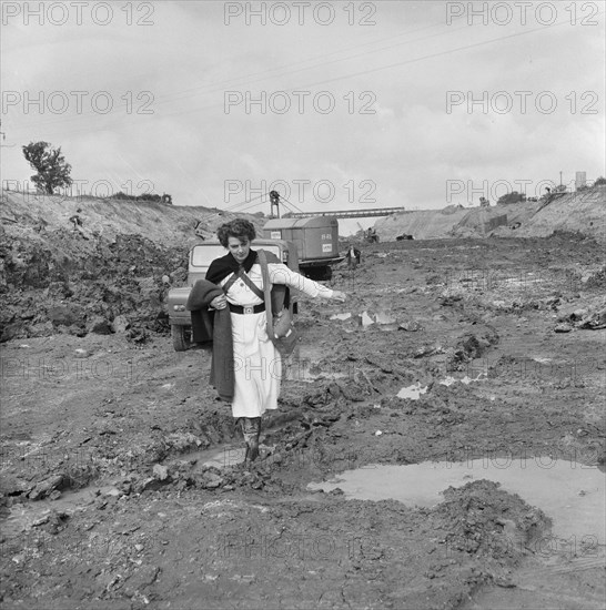 A site nurse at Section B3 of the London to Yorkshire Motorway (the M1), Milton Keynes, 09/1958. Creator: John Laing plc.