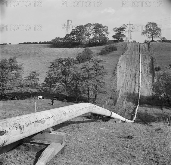 Mersey oil pipeline..., showing the pipeline after the welders have passed..., 24/09/1967. Creator: John Laing plc.