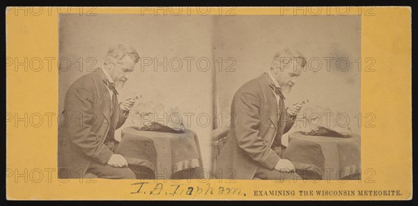 Portrait of Increase Allen Lapham (1811-1875) - Examining the Wisconsin Meteorite, Circa 1868. Creator: Hugo Broich.