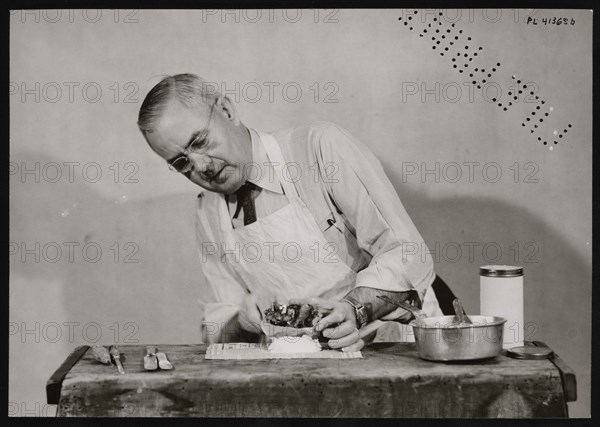 Frank Earl Holden Demonstrates Cutting into Mineral, January 18, 1951. Creator: United States National Museum Photographic Laboratory.