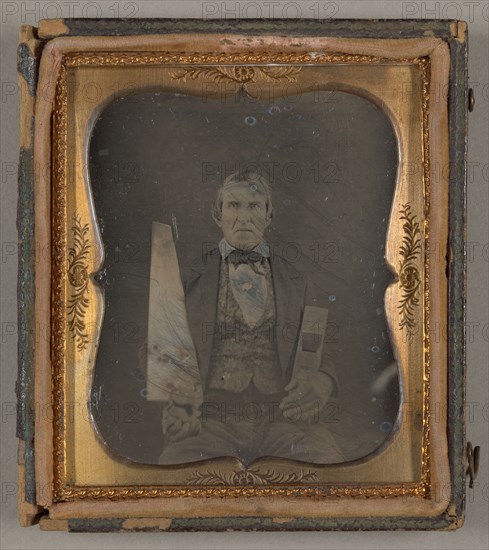Untitled [portrait of a man holding carpentry tools], 1839/99.  Creator: Unknown.