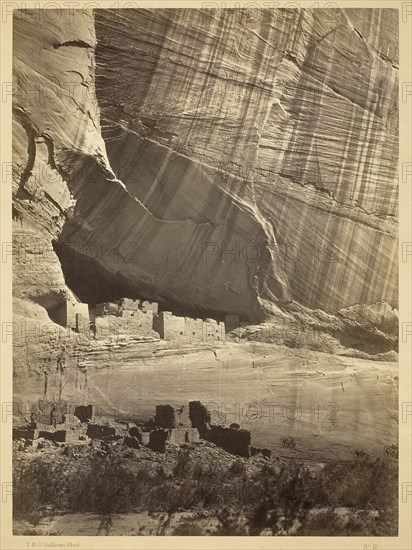 Ancient Ruins in the Cañon de Chelle, N.M. In a niche 50 feet above present Cañon bed., 1873. Creator: Tim O'Sullivan.