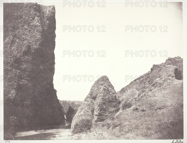 Ruisseau coulant entre une falaise et des rochers, 1854, printed 1978. Creator: Edouard Baldus.