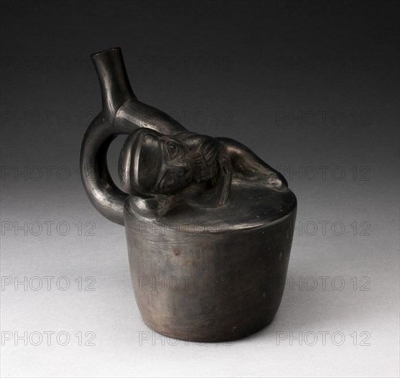 Blackware Handle Spout Vessel with Relief of a Reclining Musician with Pipes, 100 B.C./A.D. 500. Creator: Unknown.