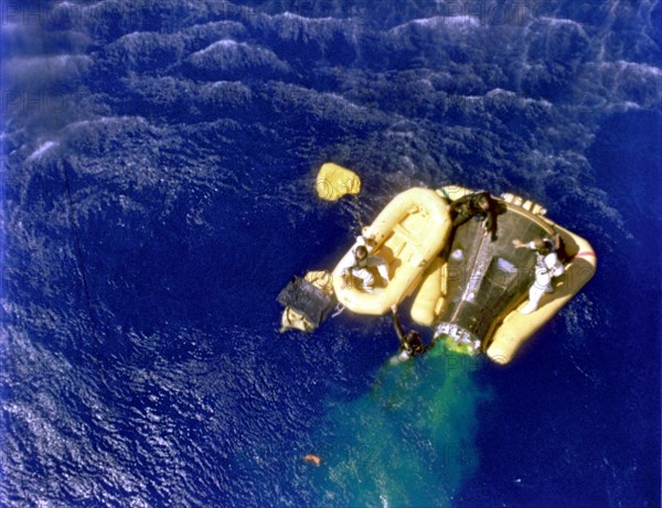 Cooper and Conrad await recovery relicopter, 1965.  Creator: NASA.