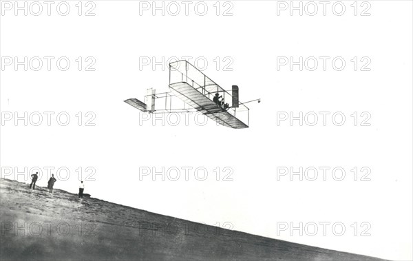 Orville Wright tests his glider at Kitty Hawk, North Carolina, USA, 1911. Creator: NASA.