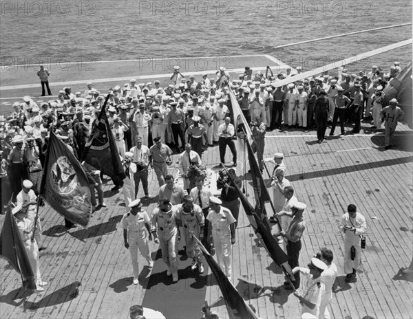 Gemini IV crew arrives on the USS Wasp, June 7, 1965.  Creator: NASA.