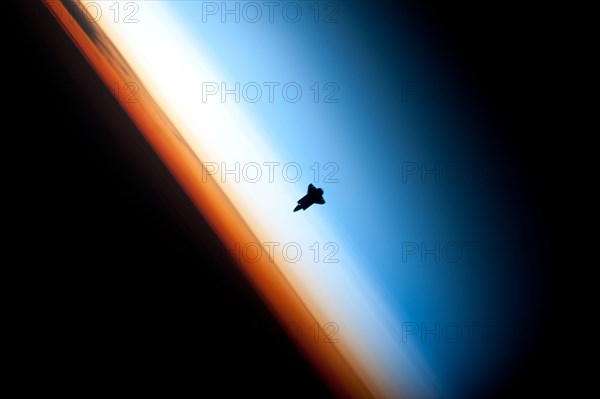 Space Shuttle Endeavour over Earth, c2010. Creator: NASA.