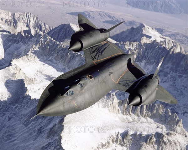 SR-71 over snow-capped mountains, USA, 1995.  Creator: NASA.