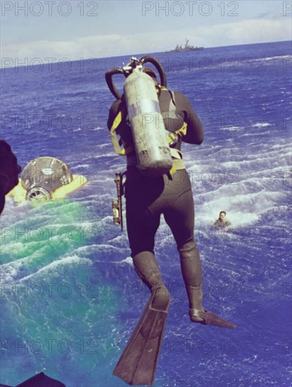 Navy diver leaps from helicopter, 1965. Creator: NASA.