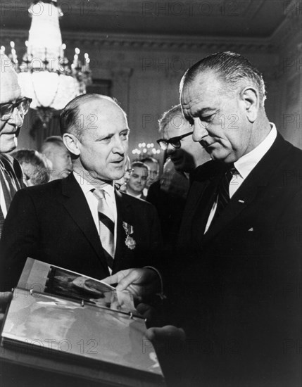 Mariner photos presented to President Johnson, 1965. Creator: NASA.