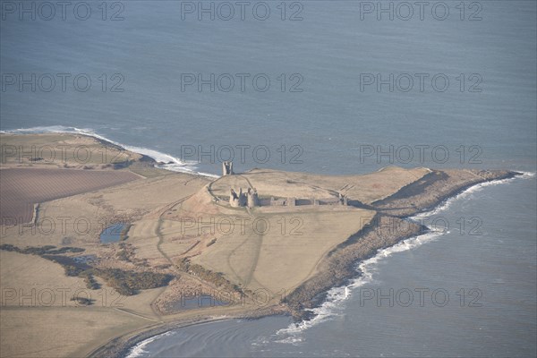 Remains of the 14th century Dunstanburgh Castle, Northumberland, 2015. Creator: Historic England.