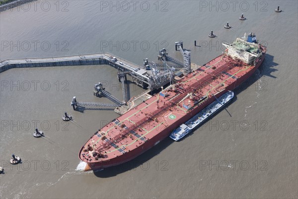 A ship moored up at floating stage on the River Mersey at Tranmere Oil Terminal, Wirral, 2015. Creator: Historic England.