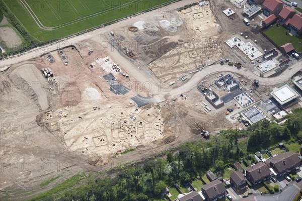 The excavation of an extensive barrow cemetery, Pocklington, East Riding of Yorkshire, 2015. Creator: Historic England.