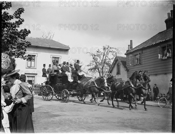 A horse-drawn coach driving past a group of cottages, Greater London Authority, 1895-1905. Creator: Charles William Prickett.