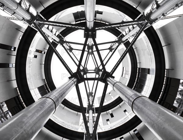 Gasholder Park, King's Cross, Camden, London, 2018. Interior view looking up through the open axis area at the centre of the three interlinked former gasholders, redeveloped as residential housing, 2018.