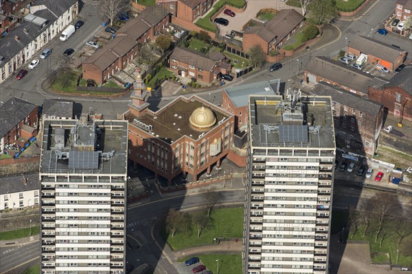 Golden Mosque overshadowed by two of the Seven Sisters towers, Rochdale, 2019. Creator: Historic England.