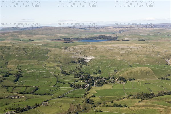 View over the village of Malham towards Malham Cove and Malham Tarn, North Yorkshire, 2019. Creator: Historic England.