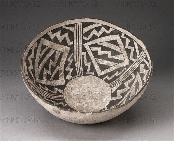 Bowl with Bold Black-on-White Diamond and Zizgag Motifs, A.D. 950/1400. Bone-colored bowl with interior decorations of bone-colored zig-zags, diamonds, and lines on a black background, a circle at the interior base.